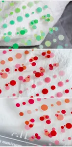 Macro shot of colorful polka dot nail art stickers with clear transparent adhesive film