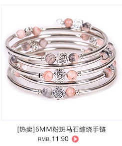 Detail of 6mm pink zebra stone beads and silver rose charms on a multi-layer wrap bracelet
