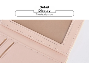 Detail view of pink leather wallet featuring a clear ID window and precise stitching
