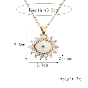 Macro view of gold evil eye pendant with size specs: 2.5x2.3cm and 45+5cm chain