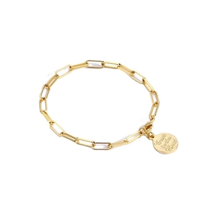 Golden paperclip chain bracelet with a round coin pendant engraved with Trust in the Lord