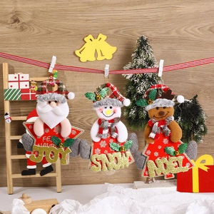 Three Christmas fabric ornaments featuring Santa, Snowman, and Reindeer with festive words