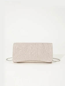 Detailed macro shot of silver glitter fabric texture and metal chain on evening bag
