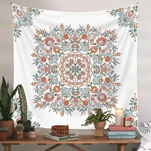 Detail of bohemian mandala tapestry hanging on wall with a cozy interior room setting