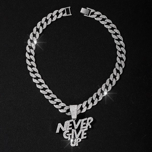 Detailed macro shot of silver iced-out Cuban chain with Never Give Up letter pendant