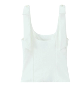 Detail of white sleeveless top showing elegant bow-knot straps and square neckline design