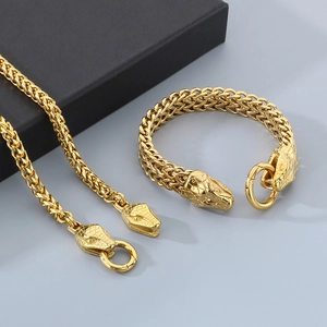 Detailed view of golden double snake head wheat chain necklace and bracelet set