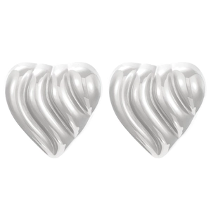 Macro shot of vintage style silver heart earrings with textured 3D ripple surface details