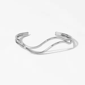 Detailed view of silver double-layer irregular wave open bangle with polished finish