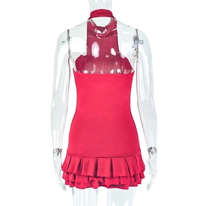 Detail view of red halter neck mini dress with layered ruffle hem on female mannequin