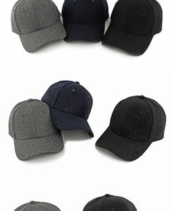 Detail of wool felt baseball caps showing texture in charcoal, navy, and black colors