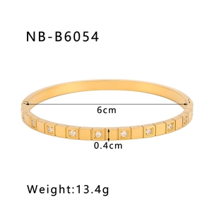 Detail of 18K gold-plated stainless steel bangle with inlaid zircons and size specs