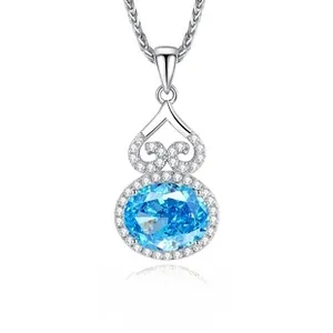 Macro shot of S925 silver gourd pendant with blue gemstone and white zircon accents