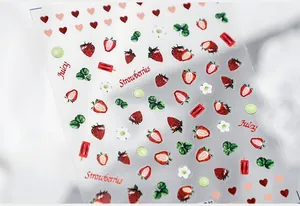 Detailed view of ultra-thin nail stickers featuring juicy strawberry and lime patterns
