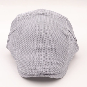 Detail of grey mesh sun hat with breathable waffle texture fabric and premium stitching