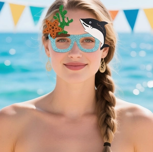 Detail of glittery blue ocean party glasses featuring starfish, shark, and coral accents