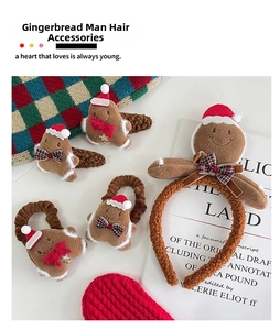 Close-up of plush gingerbread man Christmas hair accessories including headband and clips