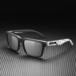 Detailed close-up of matte black square sunglasses with white graffiti art temples