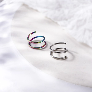 Detail of 8mm double-layer stainless steel nose rings in rainbow and silver finish