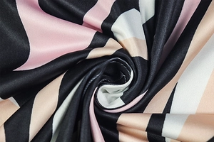 Macro shot of smooth zebra print fabric with a silky satin texture and striped pattern