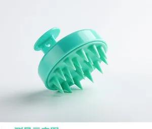 Detail view of mint green silicone scalp massager brush with flexible massage bristles