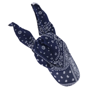 Close-up of navy blue paisley cotton bandana headscarf tied in a rabbit ear style knot