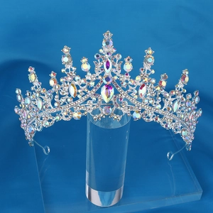 Sparkling silver crown with AB rhinestones for weddings and parties on a blue background