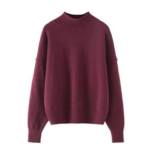 Detailed view of the ribbed knit neckline and soft burgundy fabric on a casual sweater
