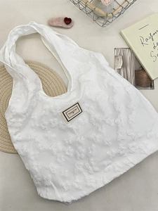 Minimalist white jacquard tote bag with 3D floral textures and Pleasant Time label