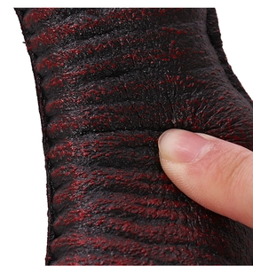 Macro detail of red and black leather material showing soft texture and high resilience