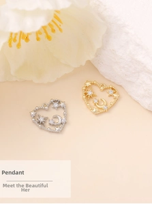 Detail of heart-shaped star and moon pendants with cubic zirconia for DIY jewelry