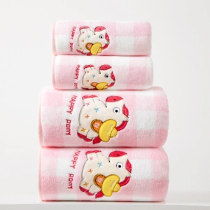 Detail of coral fleece bath towels showing pink plaid pattern and Happy Pony embroidery