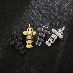 Close-up of industrial bike chain cross pendants in black, gold, silver and gunmetal