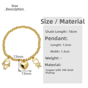 Detail view of 18K gold plated beaded bracelet with boy, girl and heart charms
