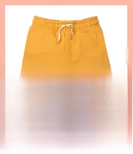 Detailed embroidery of a blue sea turtle on yellow cotton kids shorts with drawstring