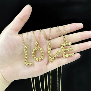 Polished gold initial letter necklaces L O V E on bead pendants with delicate chains