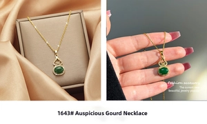 Macro shot of gold necklace featuring a green gourd pendant and delicate box chain