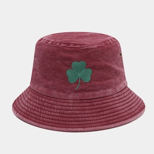 Detail of green shamrock embroidery on vintage burgundy washed cotton bucket hat