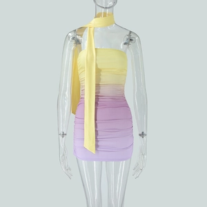 Detail of yellow-purple gradient bodycon dress with textured ruched fabric and neck strap
