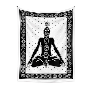 Detail of black and white meditation tapestry showing chakra symbols and lotus pose