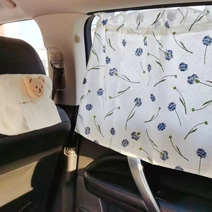 Floral car window curtain with blue flower pattern providing sun protection and privacy