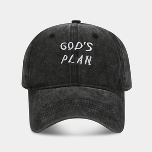 Washed black cotton baseball cap with white GODS PLAN embroidery in a vintage six-panel style