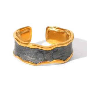 Detail of gold-plated wavy ring with grey enamel inlay and open adjustable design