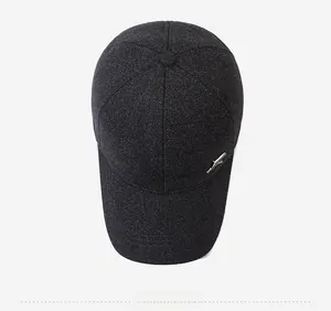 Top view of dark grey baseball cap showing six-panel structure and metal side ornament