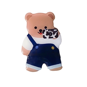 Cute brown cartoon bear phone socket stand with blue overalls and cow pattern camera