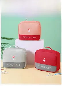 Detail of multi-compartment waterproof first aid storage bag with top handle and zippers