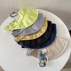 Detail view of UPF 50+ sun visors in various colors showing quick-dry polyester fabric