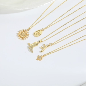 Golden necklace set with sun, cowboy boot, and floral pendants in high-polish finish