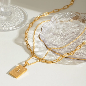 Double-layer golden stainless steel necklace with starburst engraved rectangle pendant