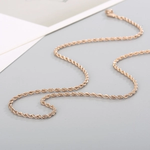 Close-up of rose gold stainless steel rope chain necklace with durable lobster clasp